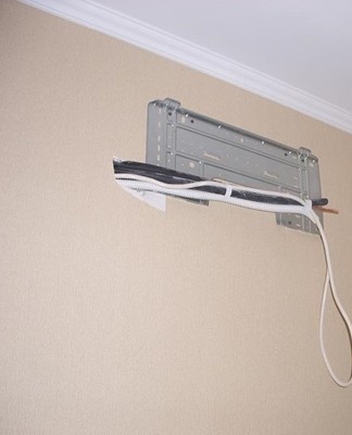 the process of installing an air conditioner in the bedroom