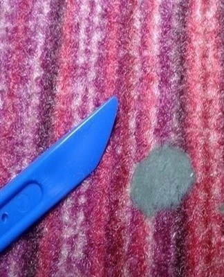 gently wipe the modeling clay stain with a cloth until the oil penetrates the structure of the fabric