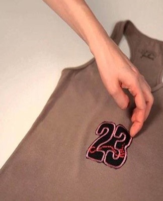 This patch may not contain an adhesive layer and is sewn by hand.