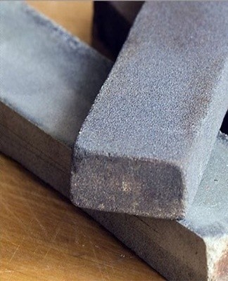 Natural whetstones come in the shape of an oval or rectangular bar.