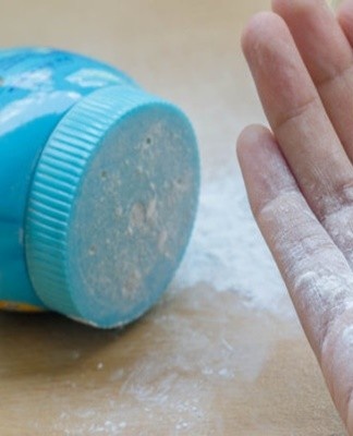 You can use talcum powder to remove greasy stains from the surface of your handbag.