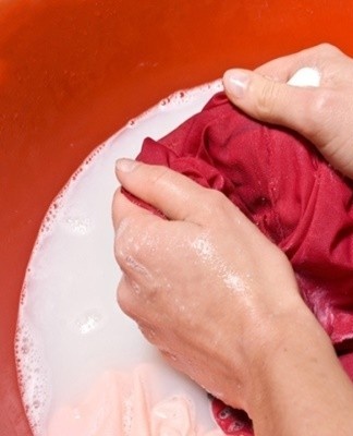 A special set of chemicals is used to remove grass stains from colored fabrics.