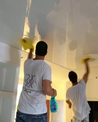 men wash the ceiling