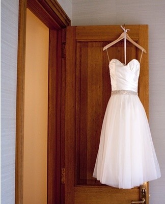 If during the wedding you immediately noticed the problem, then you can sprinkle it on the dress with white soda.