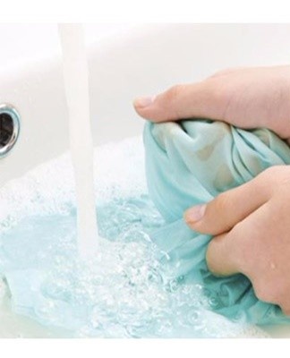 the handkerchief is placed in a soapy solution for soaking.