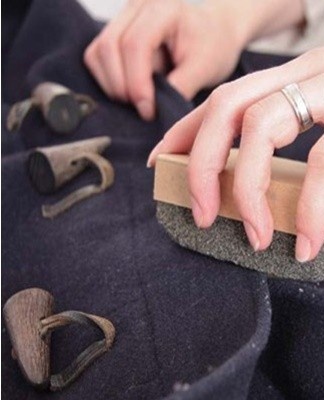 Stains on the coat should be removed before the main wash, so that traces of the stain remover are washed off afterwards.