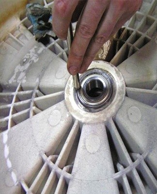 Step-by-step instructions on how to change the bearing on a washing machine