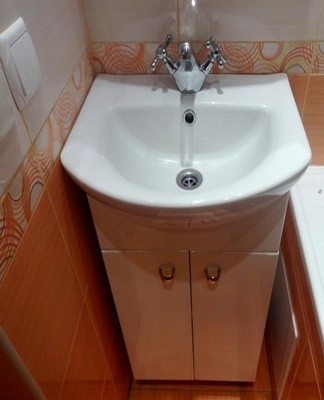 A cabinet with a sink is a ready-made design that combines the functional features of a cabinet and a sink.