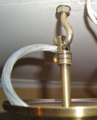 If the ceiling is lined with plasterboard or a tension structure is used, the work of attaching the loop to the hook becomes more difficult.