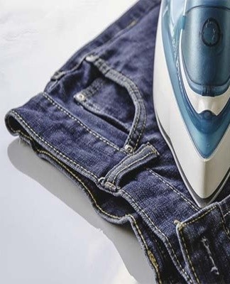 Steam ironing quickly stretches any jeans to floor size