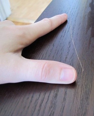 Scratches on dark wood furniture can be removed with iodine or machine oil.