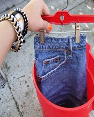 jeans are hung on a rope, any heating device is placed, the heat flow is directed to the thing.