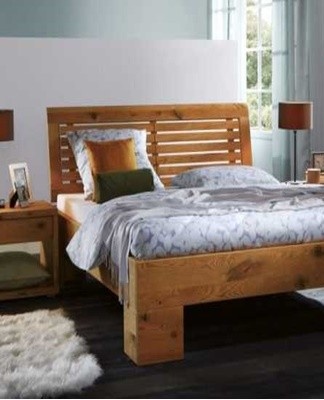 A pillow sandwiched between the headboard and the wall will help eliminate the squeaking.