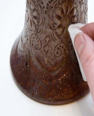 With the use of vinegar, a common method of treatment with sour dough.