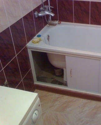 Sliding panels are installed on rails mounted along the tub and the floor.