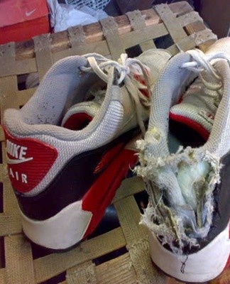 Damage to the back of the sneaker manifests itself in different ways - the fabric tears, the inner lining comes out