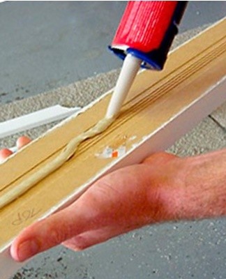 Glue contamination of hard surfaces is mechanically removed.