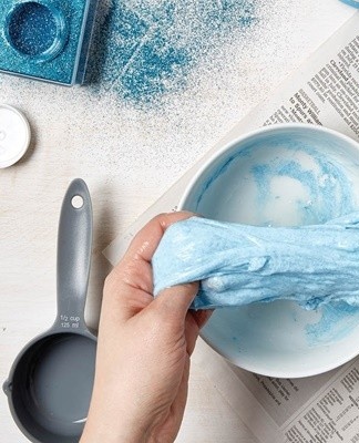 PVA glue is mixed with a small amount of water to liquefy and a dye is added.