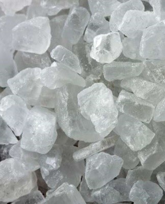 Mineral salt crystals are kept in a special transparent container.