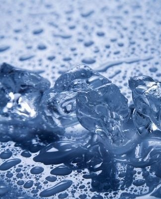 puddle of water under the fridge