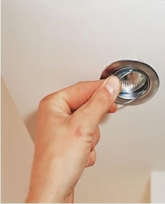 Step-by-step instructions for changing a light bulb in a stretch ceiling