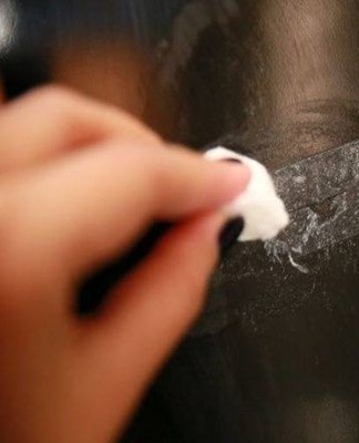 Sometimes removing the adhesive from the tape is as simple as rinsing the contaminated area with a damp cloth.