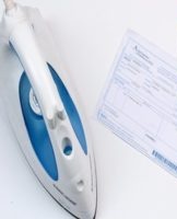 Step-by-step instructions on how to smooth out wrinkled paper with an iron or a press