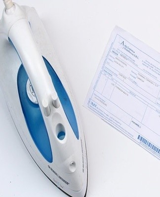 Step-by-step instructions on how to smooth out wrinkled paper with an iron or a press