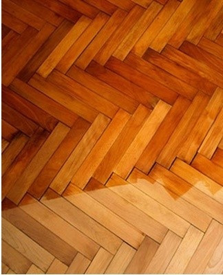 Parquet soiled after repair is first cleaned of dust and debris with a vacuum cleaner