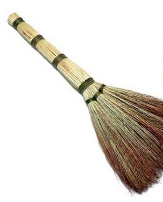 They sweep small dirt with a broom, sweep the floor.