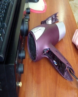 Removing the housing of a hair dryer is often difficult, as its parts are held together with internal latches.