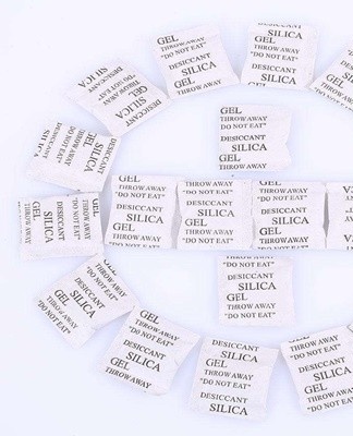 We take several tablets of activated carbon and silica gel, which are sold in small paper bags.