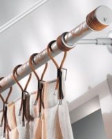 Instructions on how to hang and secure the curtain rod to the wall