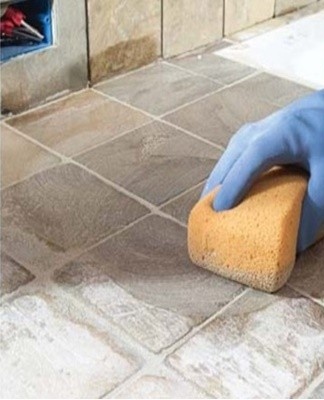 If the kitchen tiles are stained with grease and there's Selena Stove Cleaner on the shelf, use it for a thorough cleaning.