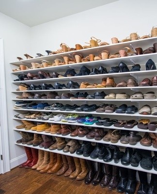 The staircase in the house can be used not only for its intended purpose, but also as storage for shoes,