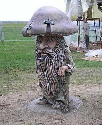 Wooden figures look harmonious among the greenery of the site, they persist for a long time if you carry out regular processing