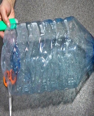 To make a travel or garden sink, cut off the bottom of the bottle, turn it upside down, and hang it somewhere convenient.