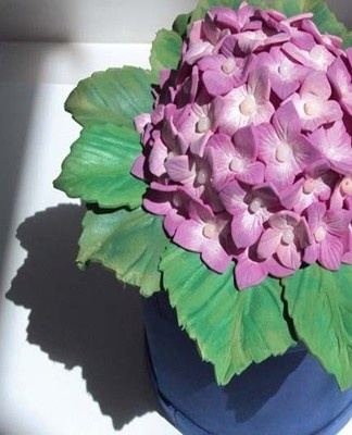 You can make artificial flowers with your own hands from fabric or paper.