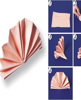 Fold the napkin in half, folding the top edge 1/3 outward.