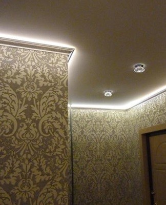 LED strips around the perimeter of the ceiling, small chandelier lamps, stylized antiques.