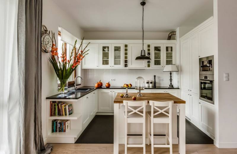 Wall panels, white furniture should contrast with bright textiles.