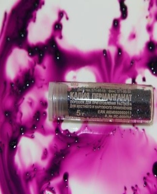 A cotton ball or rag is moistened in a weak solution of potassium permanganate and the surface of the objects is wiped.