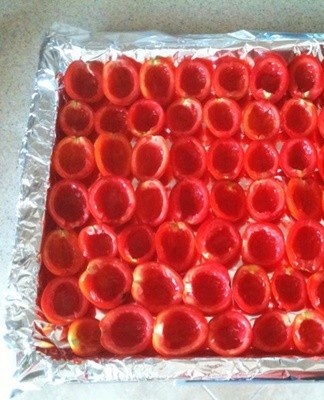 Fruits should be cut in half and put in a baking sheet.