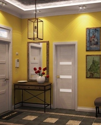 The red and orange accents inside are in harmony with the pale apricot walls and the gray and yellow furniture.