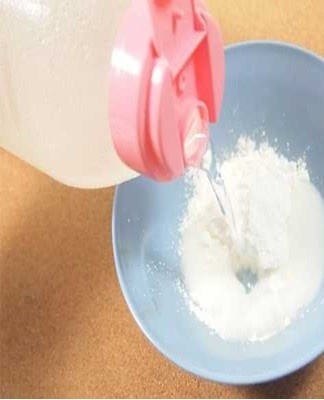 A solution of chalk, alcohol and water will help remove paint particles.