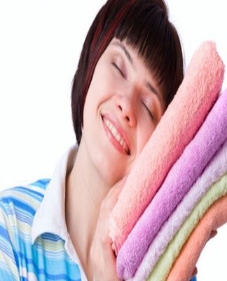 You can soften the terry cloth by soaking it for a few hours in a solution of salt and ammonia.