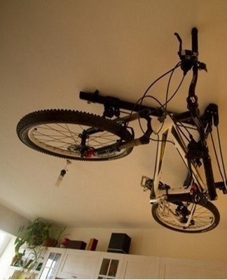 The bike can be suspended from the ceiling using various brackets