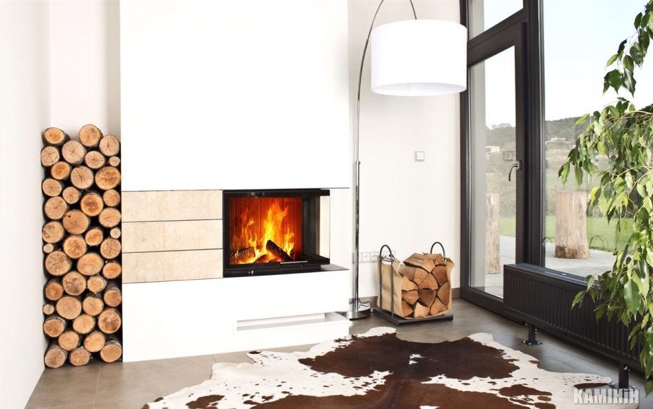 An interesting option would be an island fireplace, equipped with a dome-shaped chimney.