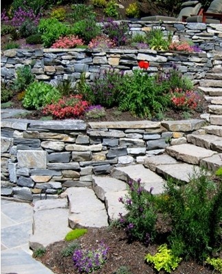 The stone terraced garden has horizontal walls and terraces.