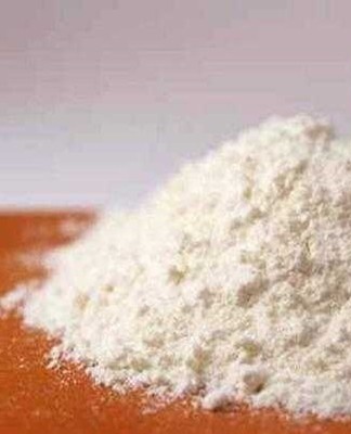 Dark yellow powder interspersed with a brownish tint.